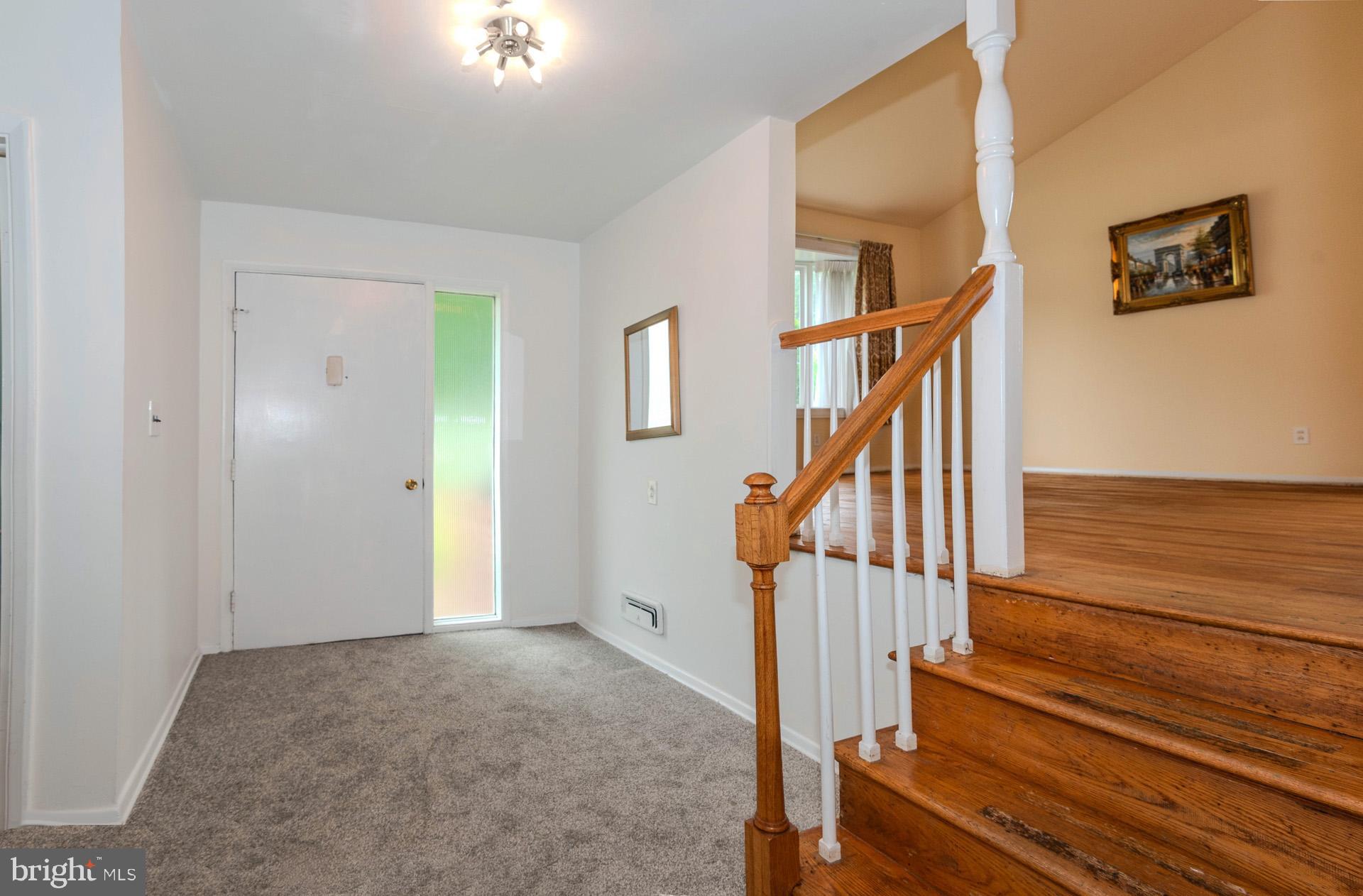 208 Ardmore Road Linthicum Heights, MD 21090 - Photo 8 of 58 a view of staircase with wooden floor and a rug
