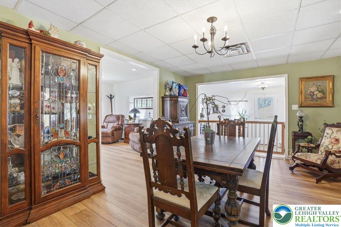 4880 Little Gap Road Kunkletown, PA 18058 - Photo 29 of 100 This dining area showcases elegant wood flooring and a chandelier, perfect for entertaining.