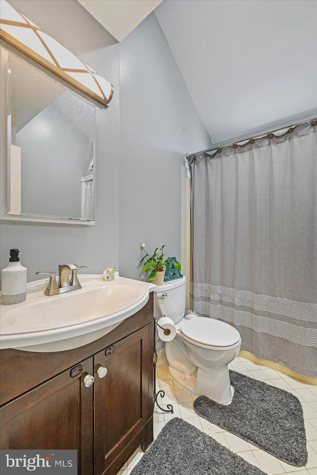 3124 Sollers Point Road Dundalk, MD 21222 - Photo 13 of 24 a bathroom with a sink toilet and shower
