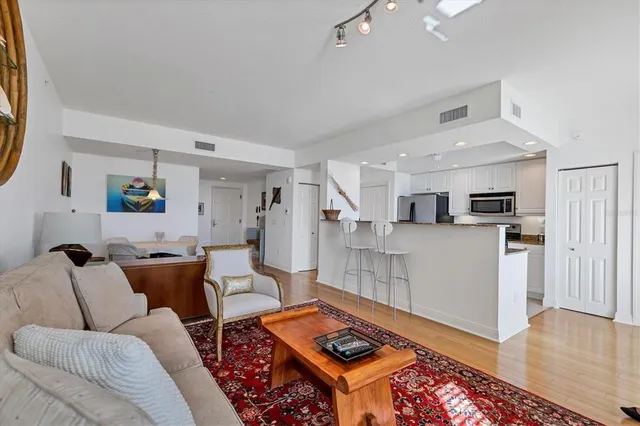 a kitchen with stainless steel appliances a refrigerator and a stove top oven