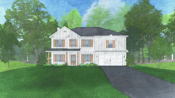 a front view of a house with a yard and trees