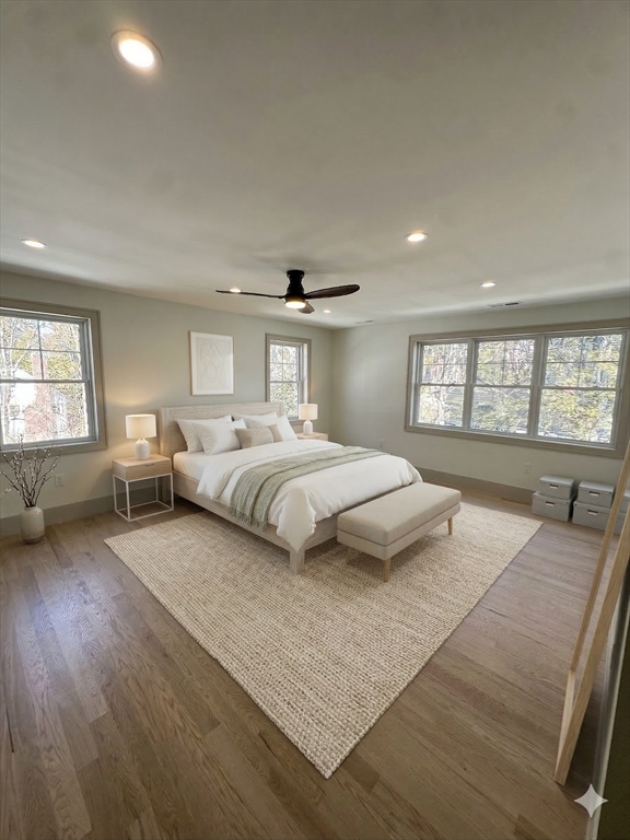 104 Page Road Bedford, MA 01730 - Photo 11 of 24 a bedroom with a large bed and a large window