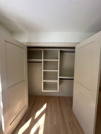 a view of an empty walk in closet