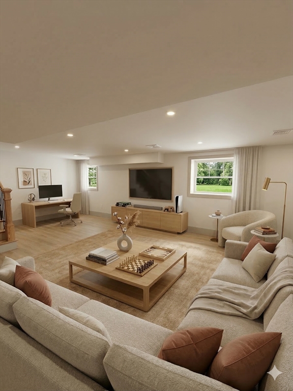 104 Page Road Bedford, MA 01730 - Photo 22 of 24 a living room with furniture and a table