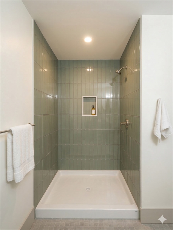 104 Page Road Bedford, MA 01730 - Photo 23 of 24 a bathroom with a bathtub