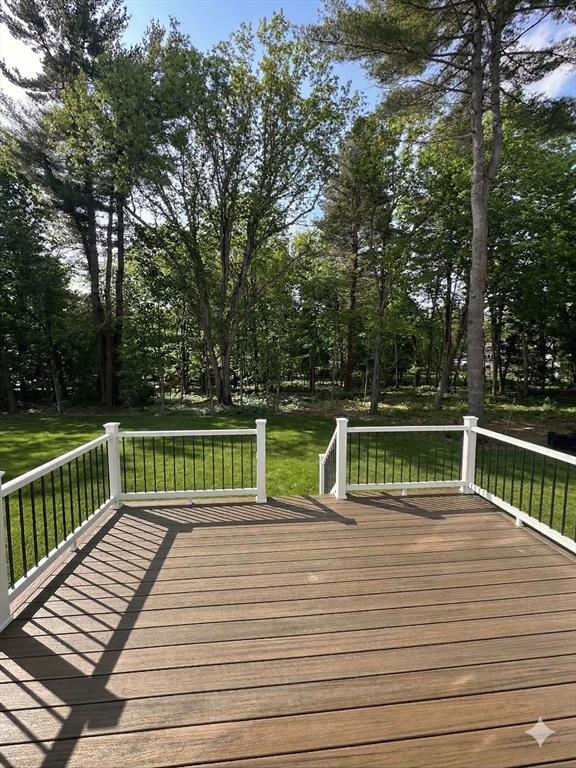 104 Page Road Bedford, MA 01730 - Photo 24 of 24 a view of a balcony with wooden floor and fence