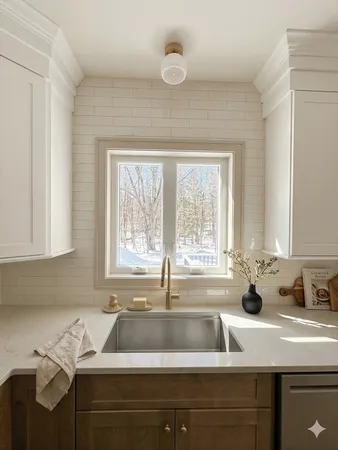 a kitchen with a sink and a window