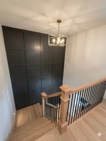 a view of a hallway with stairs