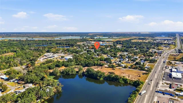 a view of a house with garden and yard