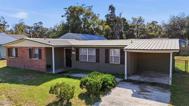 aerial view of a house with a garden and plants