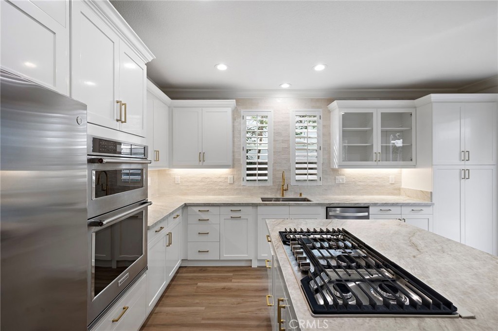 5 Citrus Lane Ladera Ranch, CA 92694 - Photo 12 of 54 a kitchen with stainless steel appliances a stove sink and cabinets