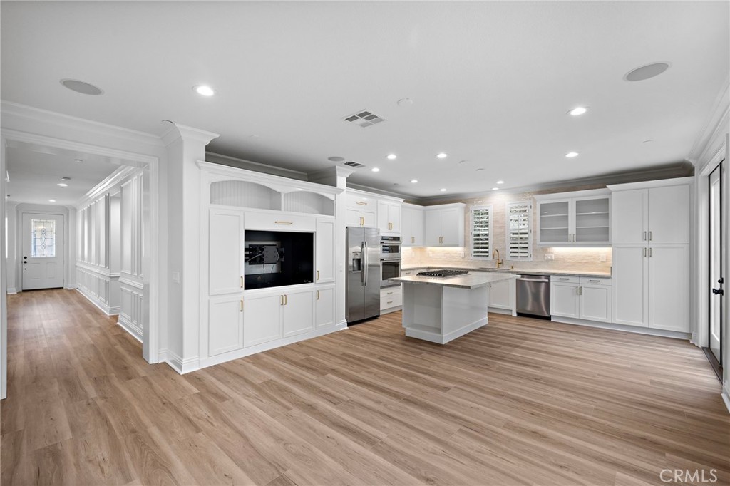 5 Citrus Lane Ladera Ranch, CA 92694 - Photo 15 of 54 a view of a kitchen with furniture and wooden floor