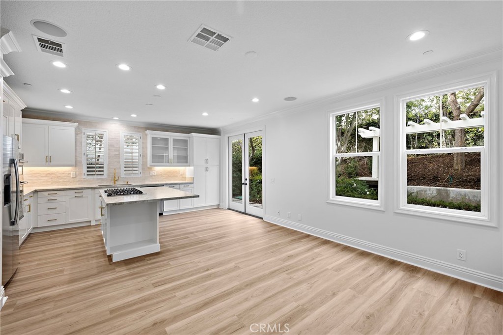 5 Citrus Lane Ladera Ranch, CA 92694 - Photo 16 of 54 a kitchen with a wooden floor and window