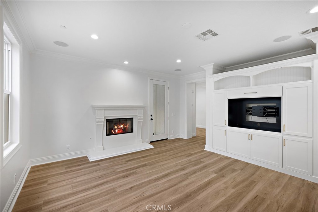 5 Citrus Lane Ladera Ranch, CA 92694 - Photo 17 of 54 a view of an empty room with wooden floor and a window