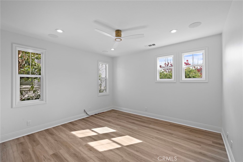 5 Citrus Lane Ladera Ranch, CA 92694 - Photo 26 of 54 a view of an empty room with a window and wooden floor