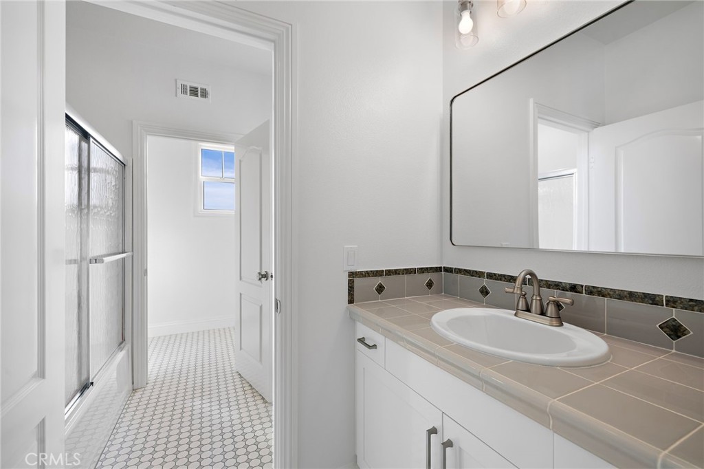 5 Citrus Lane Ladera Ranch, CA 92694 - Photo 29 of 54 a bathroom with a sink and a mirror