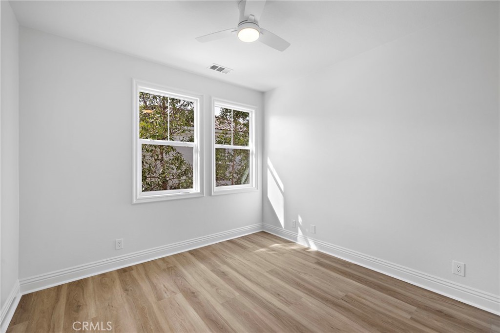 5 Citrus Lane Ladera Ranch, CA 92694 - Photo 30 of 54 an empty room with wooden floor and windows