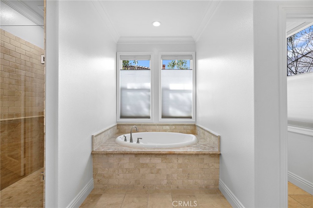 5 Citrus Lane Ladera Ranch, CA 92694 - Photo 32 of 54 a bathroom with a tub sink and window