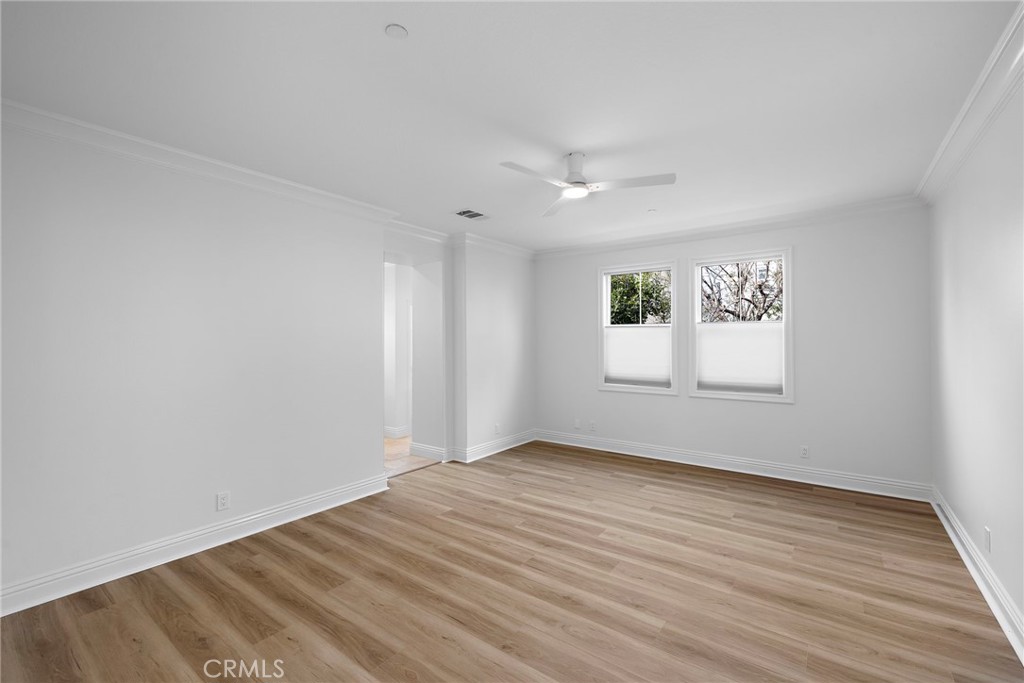 5 Citrus Lane Ladera Ranch, CA 92694 - Photo 36 of 54 an empty room with wooden floor and windows