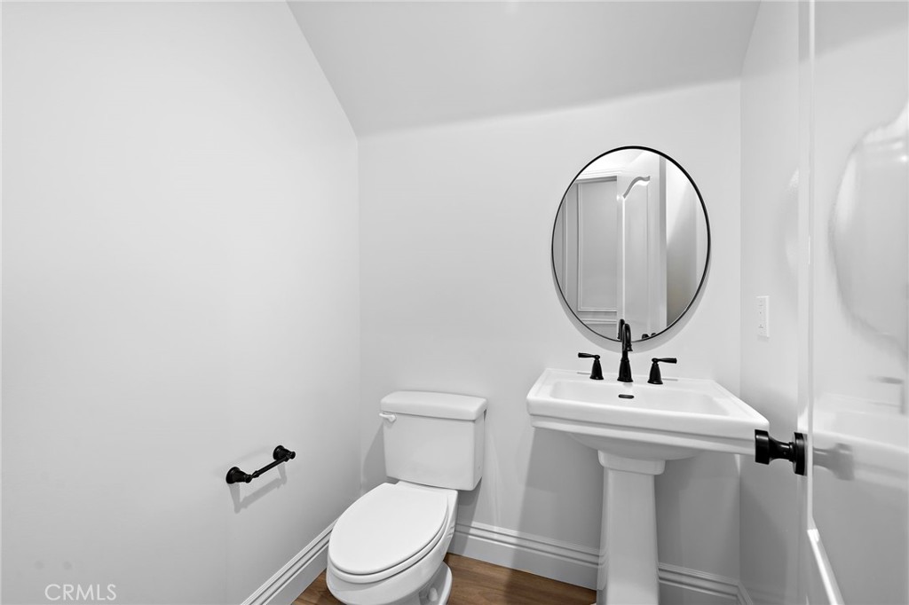 5 Citrus Lane Ladera Ranch, CA 92694 - Photo 9 of 54 a bathroom with a toilet a sink and a mirror