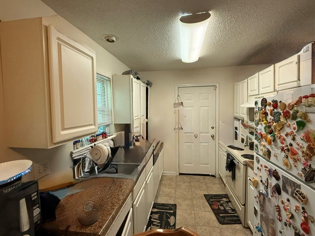 1030 Mc Kinney Street Anderson, SC 29621 - Photo 4 of 6 Functional kitchen with ample cabinet space and a practical layout.