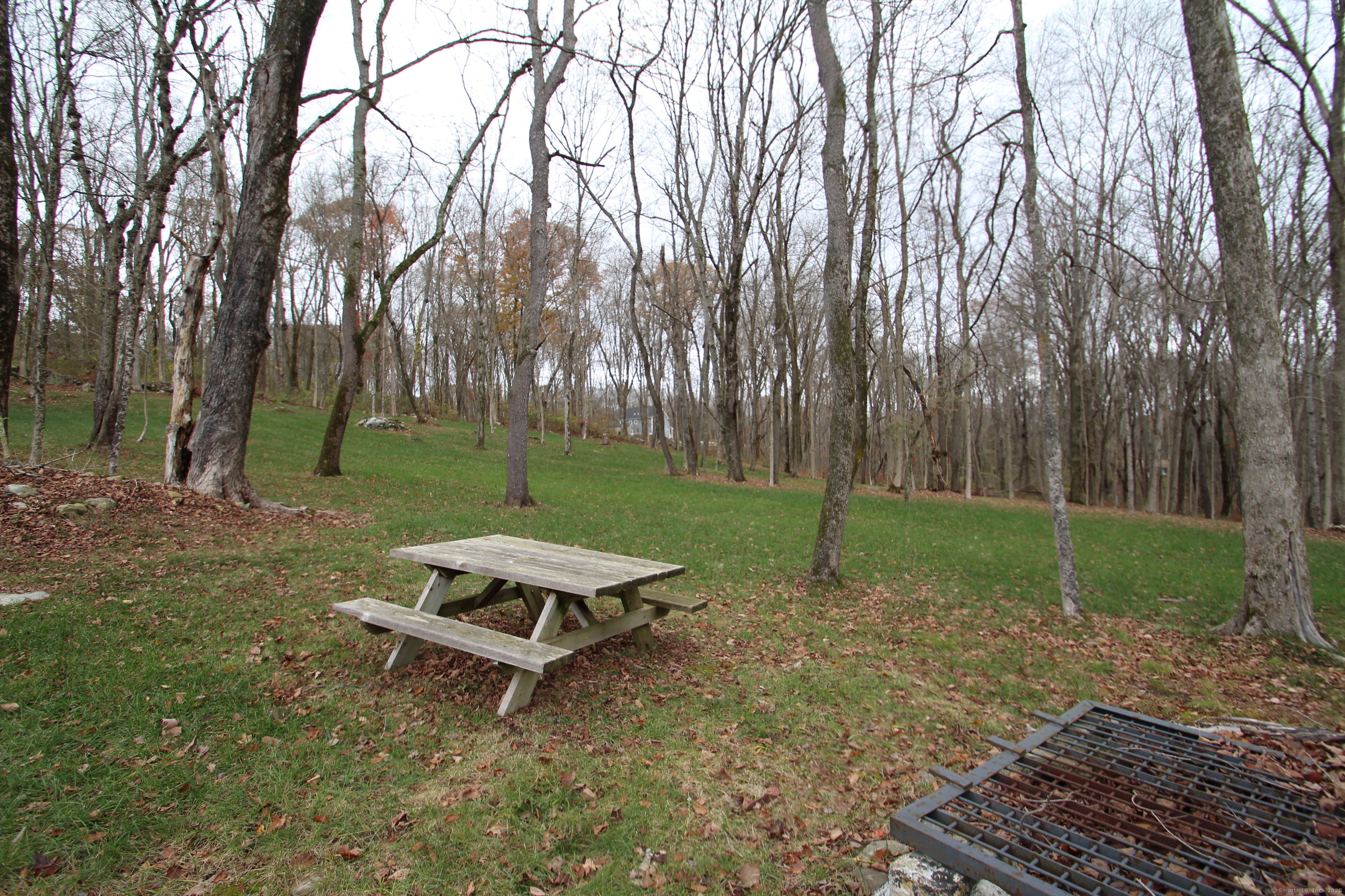 408 Fitchville Road Bozrah, CT 06334 - Photo 3 of 14 a backyard of a house with lots of green space