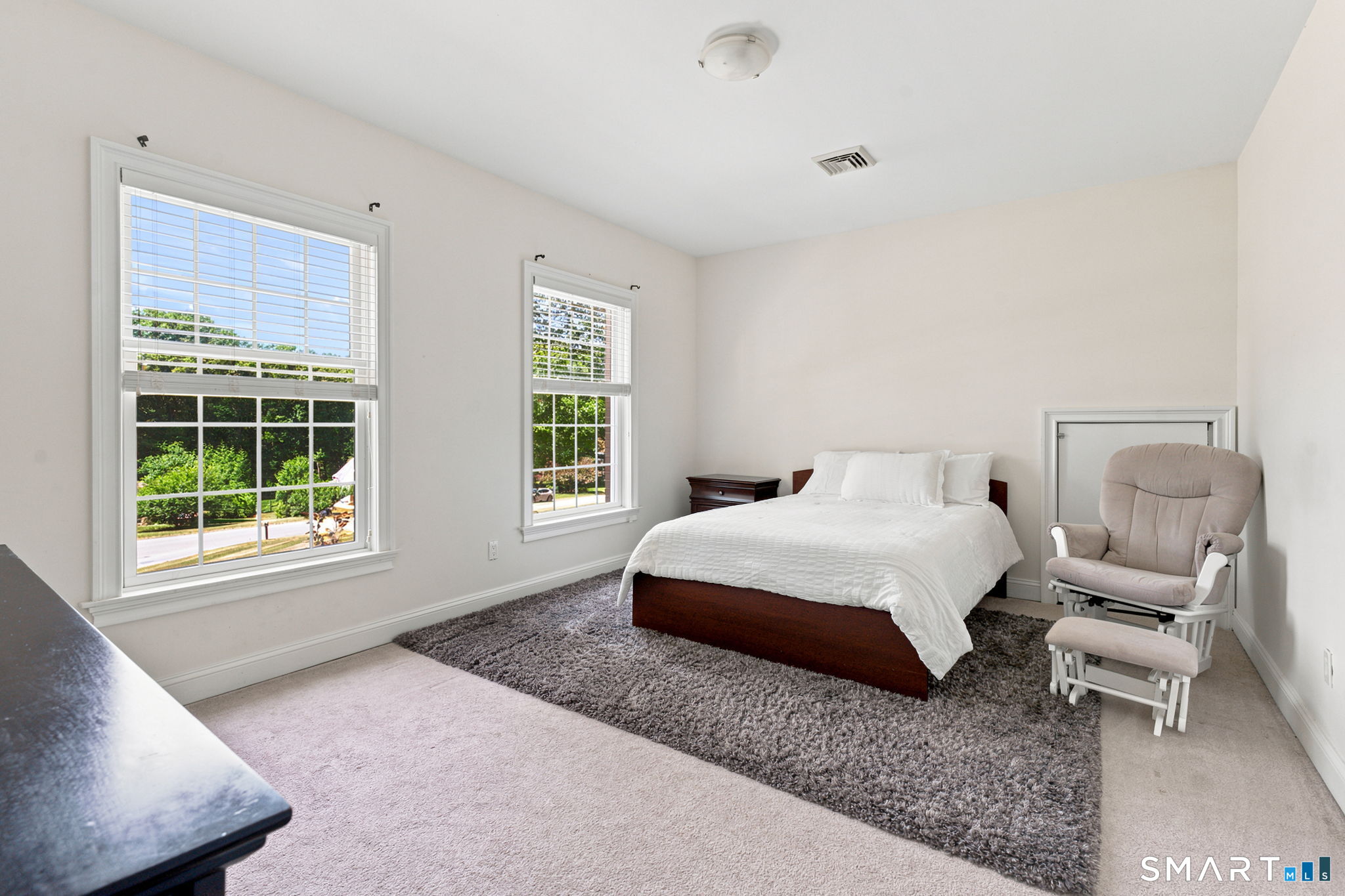 52 Country Club Road Bolton, CT 06043 - Photo 27 of 36 a spacious bedroom with a bed and window