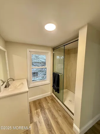 a bathroom with a tub and a shower