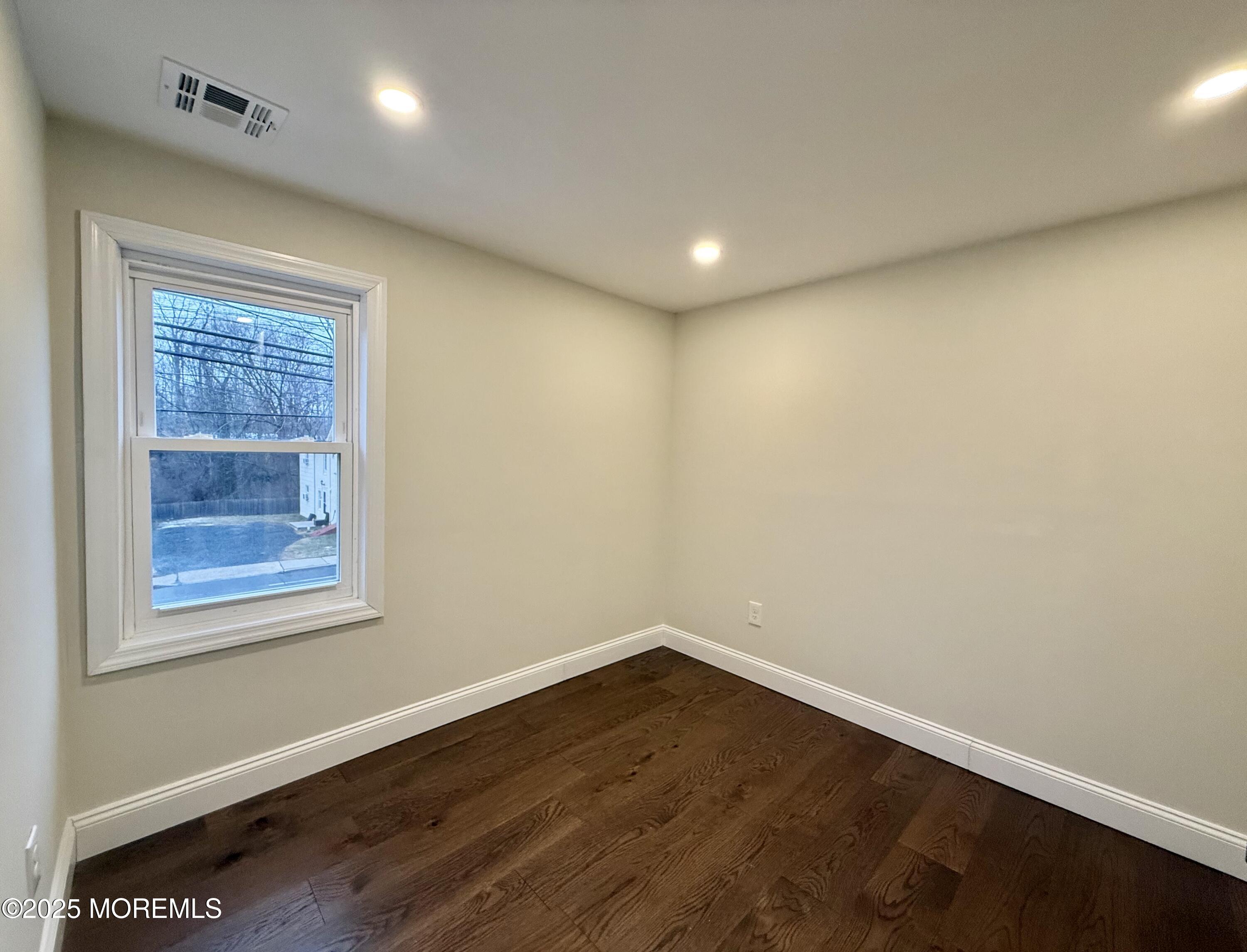 30 New Egypt Cookstown Road New Egypt, NJ 08533 - Photo 18 of 21 an empty room with wooden floor and windows