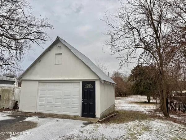 a view of a garage with a tree