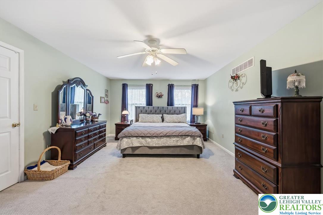2011 Fieldview Drive Nazareth, PA 18064 - Photo 21 of 52 Comfortable primary bedroom with soft carpeting and natural light.