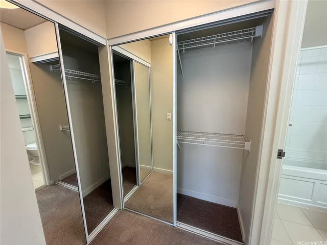 a bathroom with a toilet a sink and shower