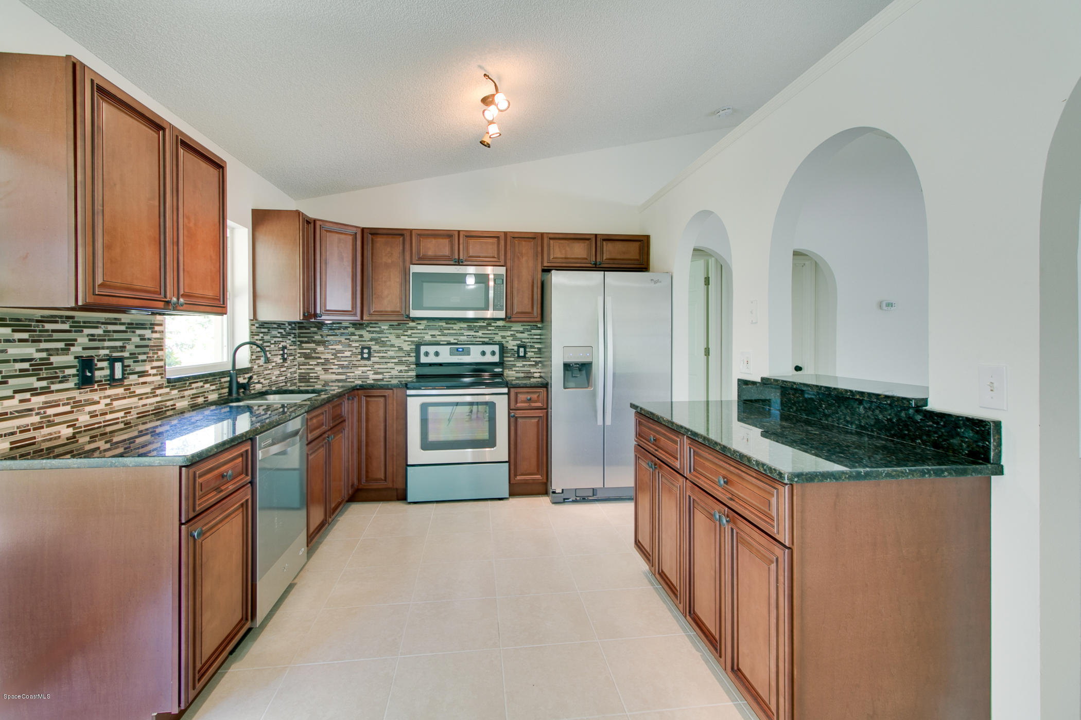 390 Warner Road Southwest Palm Bay, FL 32908 - Photo 11 of 32 Kitchen with All Wood Cabinets