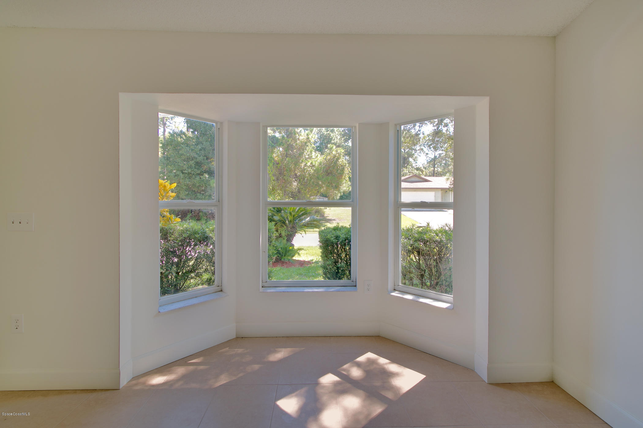 390 Warner Road Southwest Palm Bay, FL 32908 - Photo 8 of 32 Bay Window Overlooking Front Yard