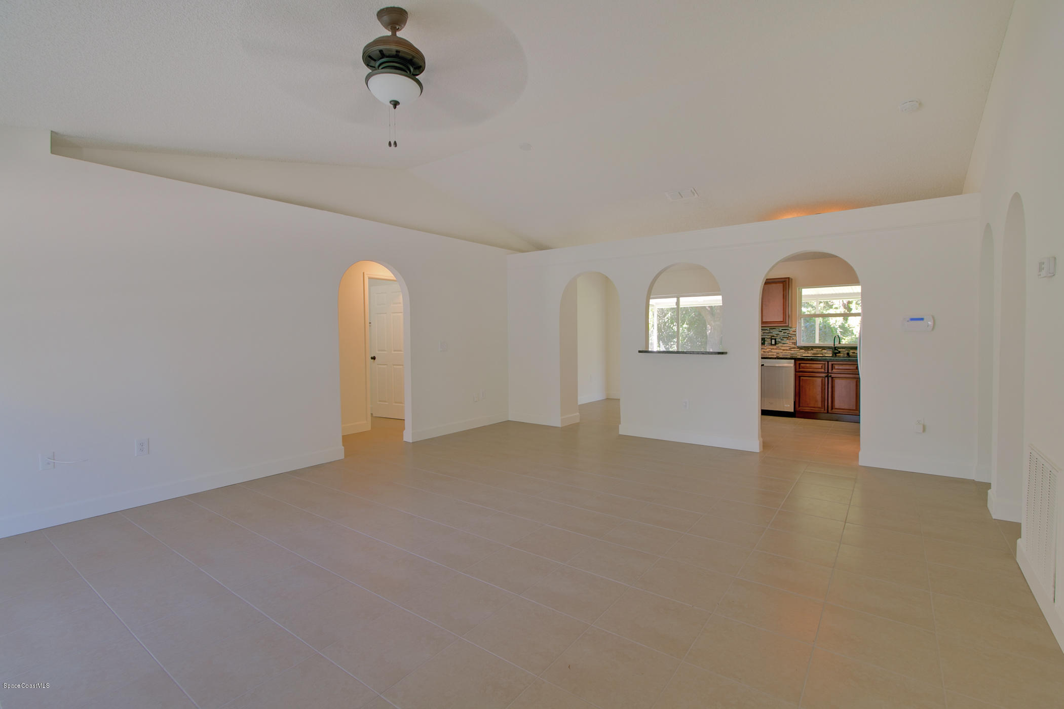 390 Warner Road Southwest Palm Bay, FL 32908 - Photo 9 of 32 Living and Dining Room