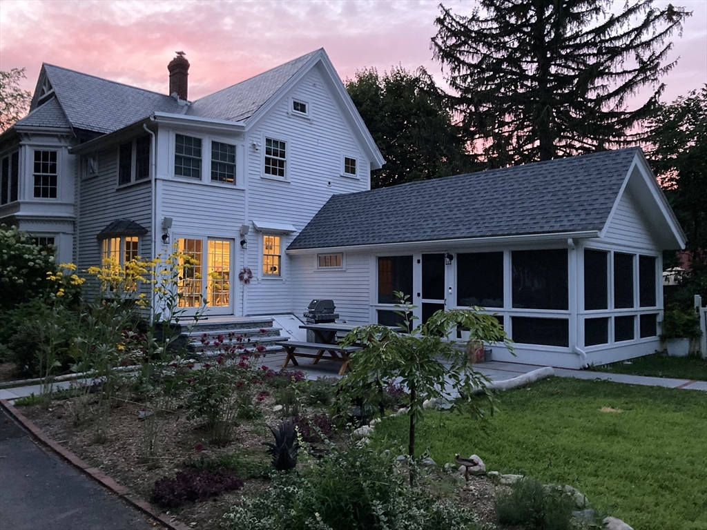 674 Webster Street Needham, MA 02492 - Photo 2 of 10 a front view of a house with garden