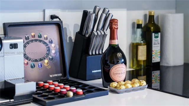 a living room with a couch and paintings on the wall