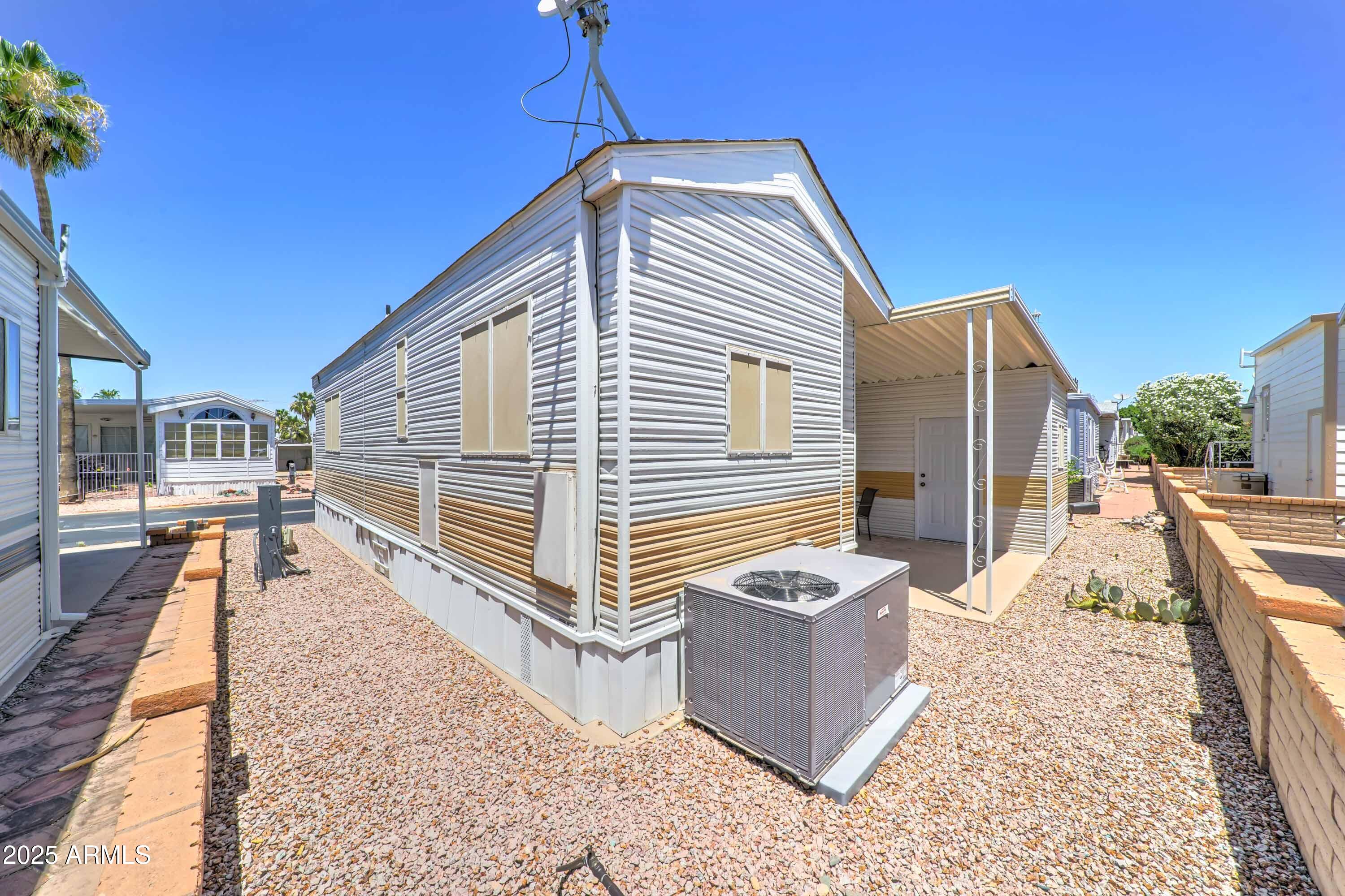 111 South Greenfield Road, Unit 405 Mesa, AZ 85206 - Photo 14 of 22 a view of a house with backyard