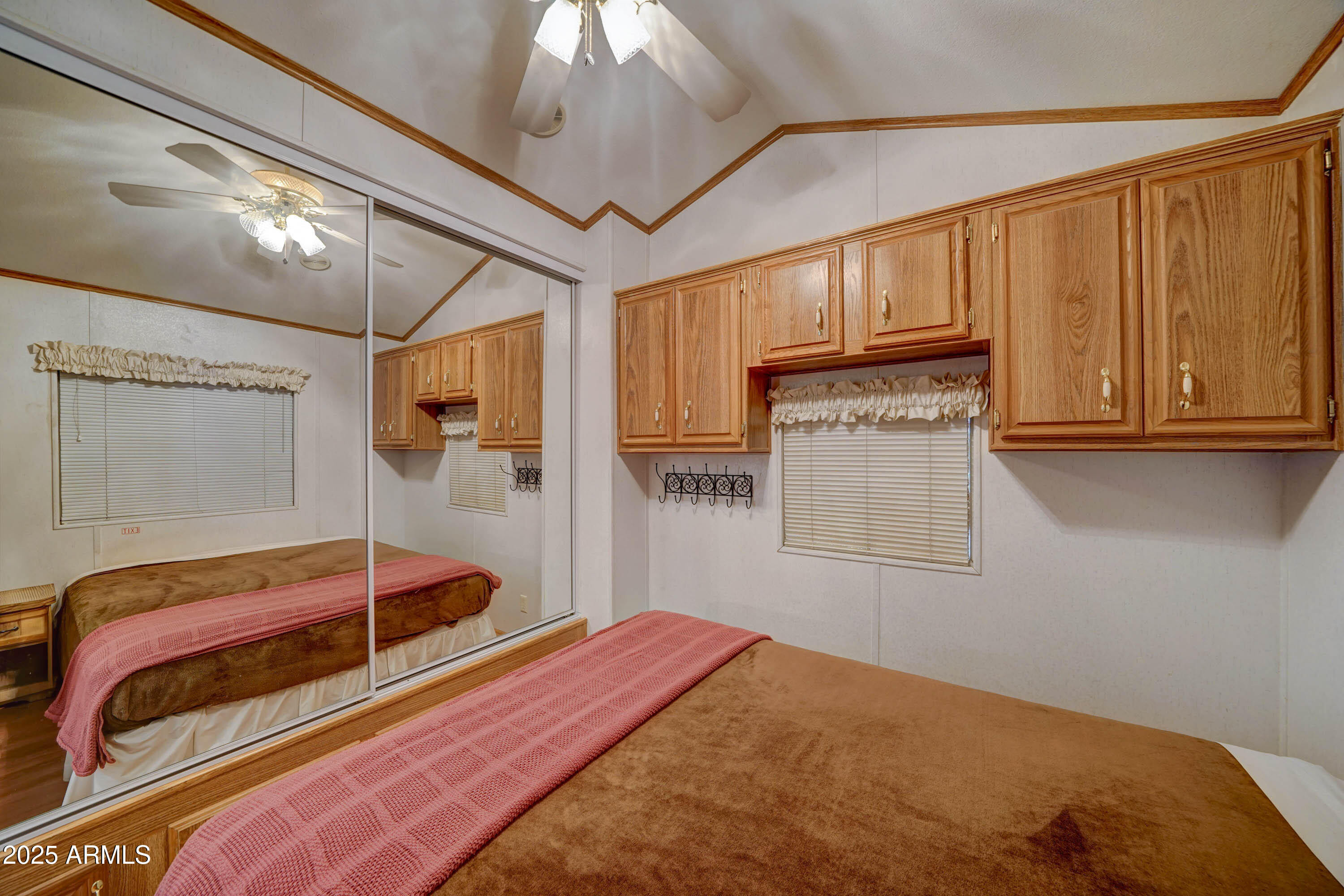 111 South Greenfield Road, Unit 405 Mesa, AZ 85206 - Photo 6 of 22 a bedroom with a bed and a closet