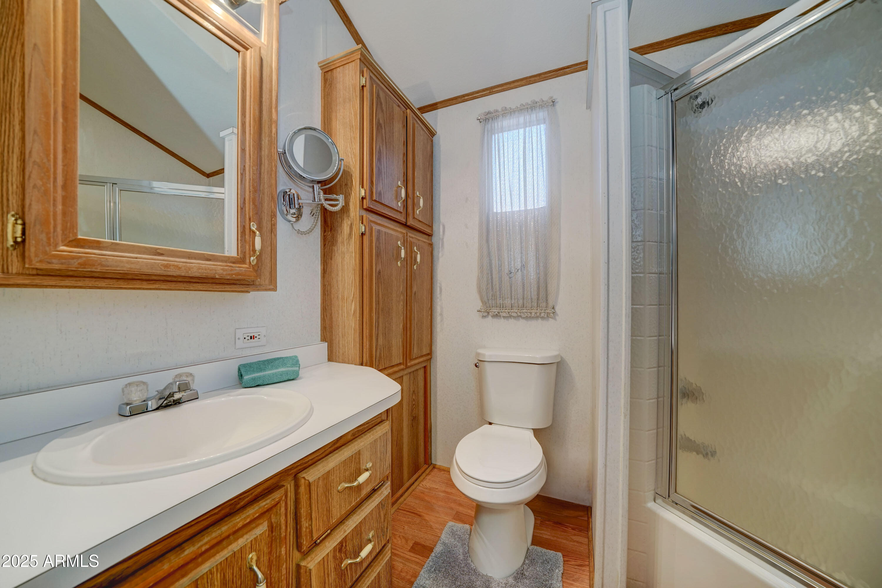 111 South Greenfield Road, Unit 405 Mesa, AZ 85206 - Photo 8 of 22 a bathroom with a sink a toilet and shower