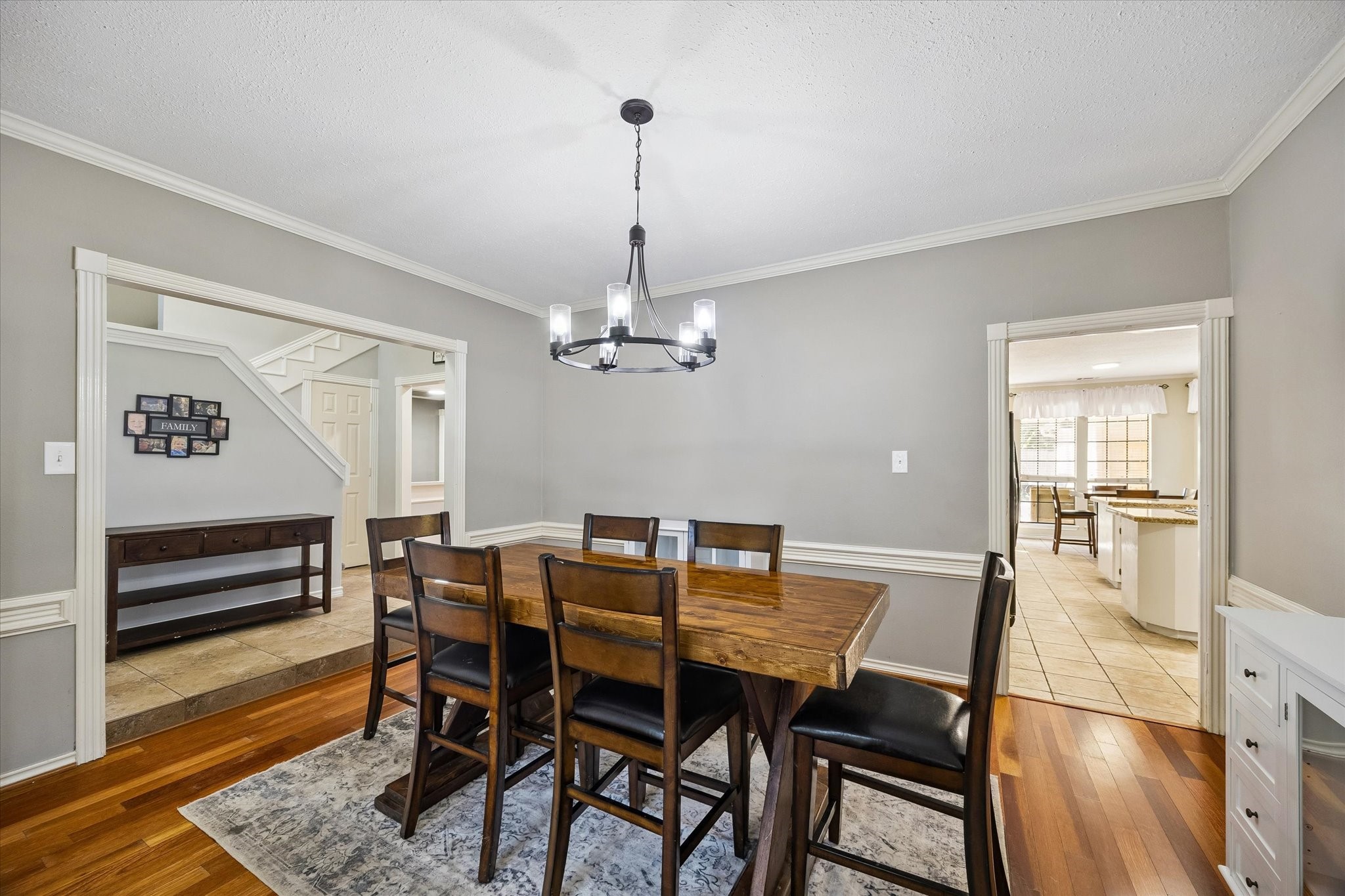 5823 Ashmere Lane Spring, TX 77379 - Photo 13 of 35 a view of a dining room with furniture wooden floor and a chandelier