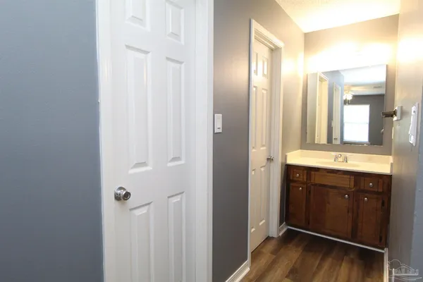 a bathroom with a mirror and a sink