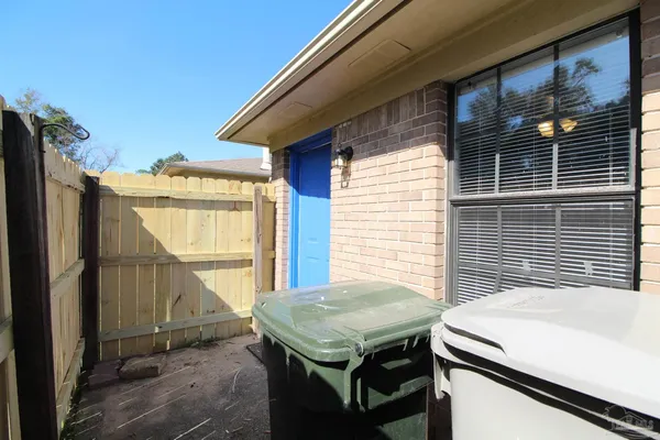 a balcony with a table and chairs