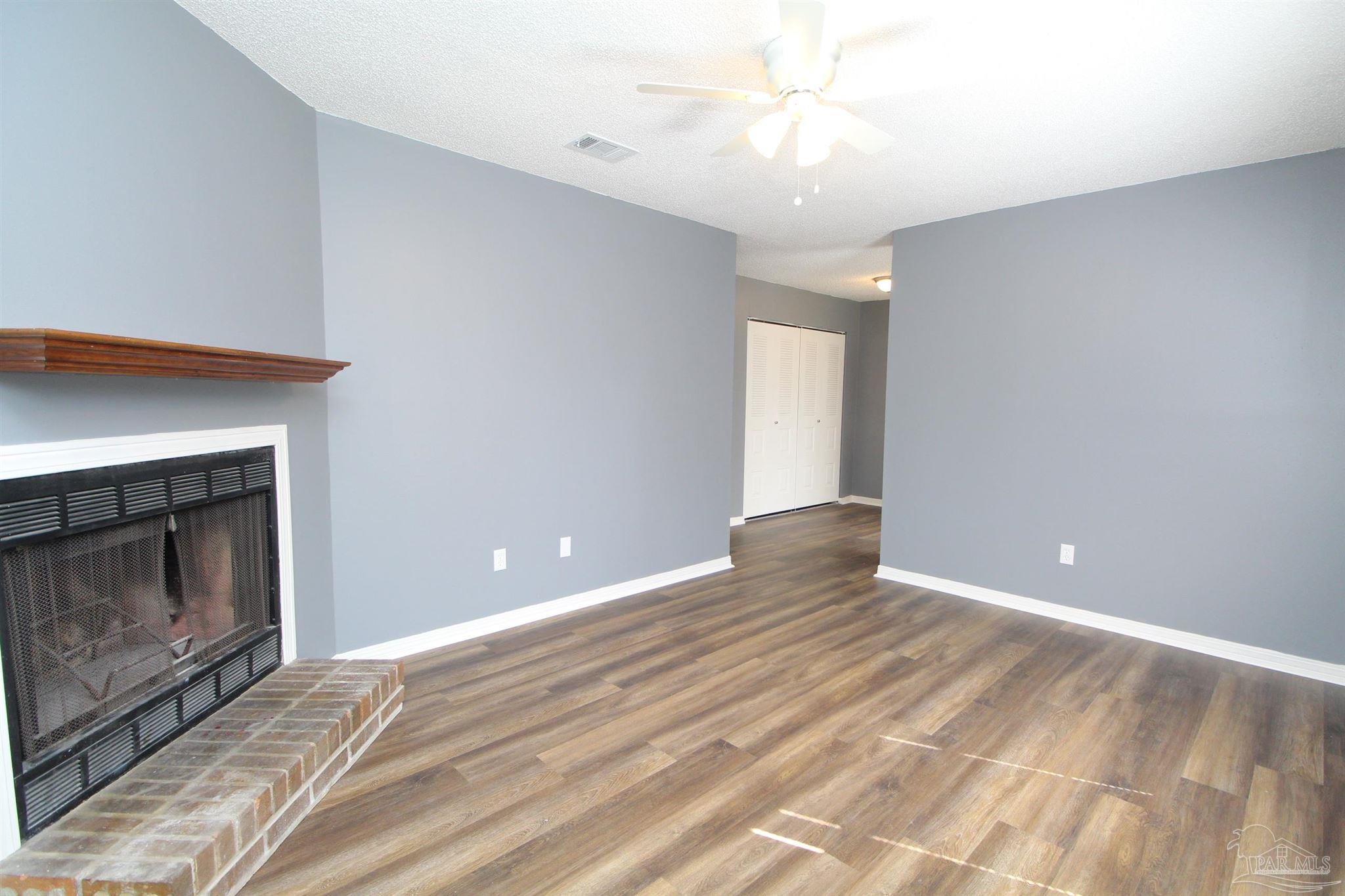 2995 Junction Drive, Unit C4 Cantonment, FL 32533 - Photo 3 of 14 a view of an empty room with window and fire place