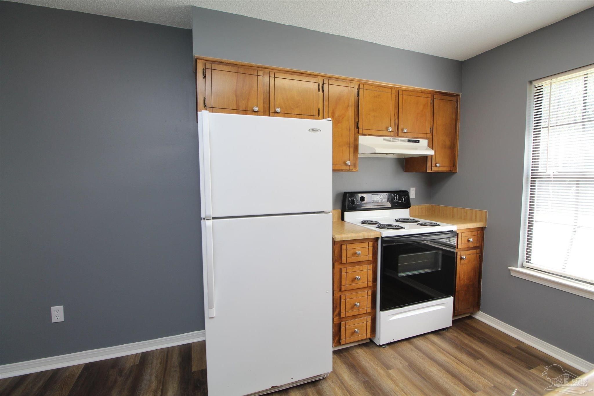 2995 Junction Drive, Unit C4 Cantonment, FL 32533 - Photo 5 of 14 a view of kitchen with washer and dryer