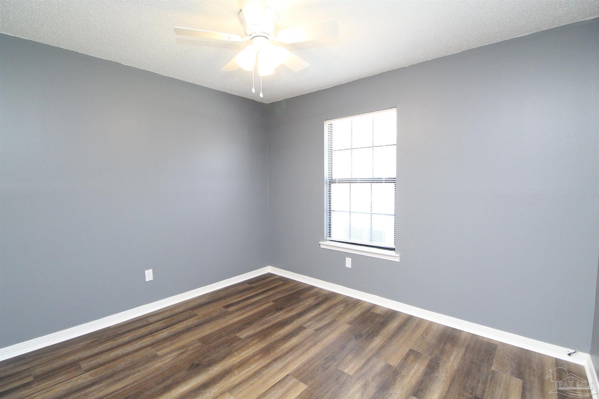 2995 Junction Drive, Unit C4 Cantonment, FL 32533 - Photo 7 of 14 an empty room with a window