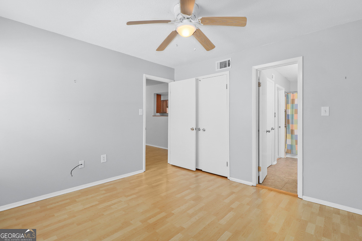 401 North Cromwell Road, Unit 2Q Savannah, GA 31410 - Photo 17 of 35 a view of empty room with ceiling fan