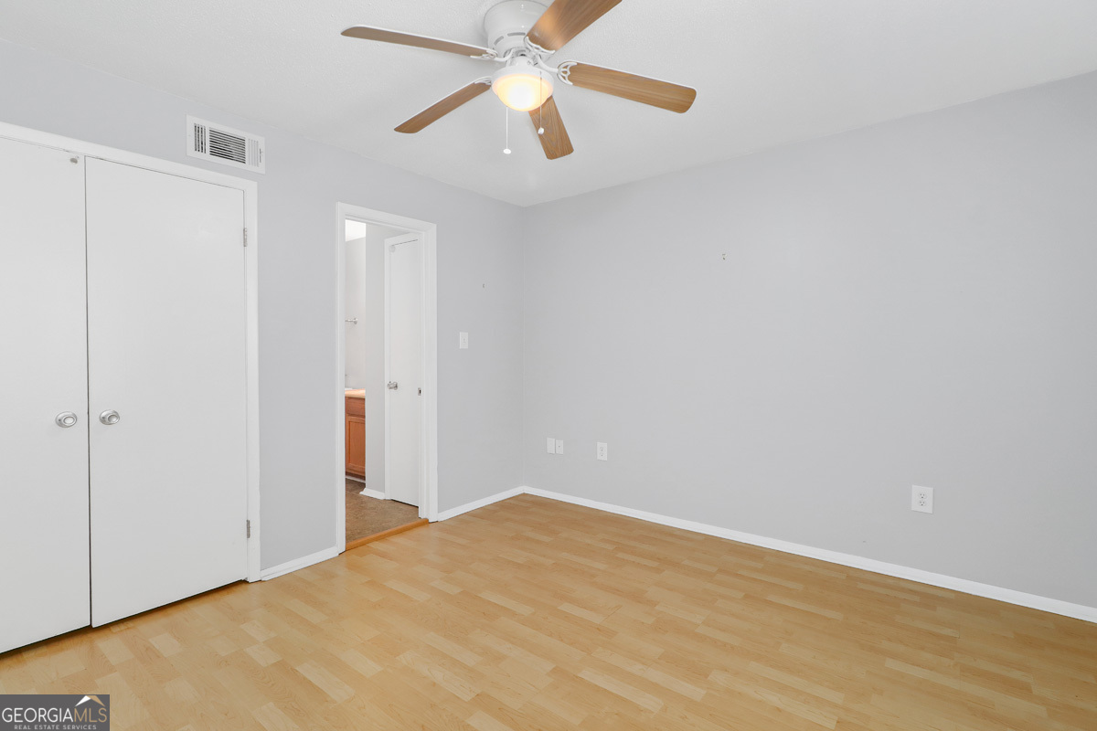 401 North Cromwell Road, Unit 2Q Savannah, GA 31410 - Photo 18 of 35 a view of empty room with wooden floor