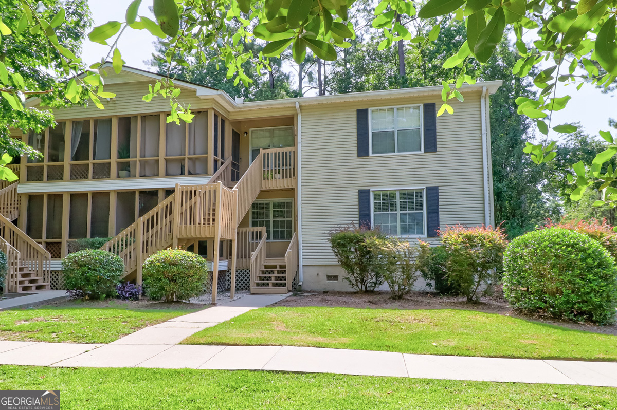 401 North Cromwell Road, Unit 2Q Savannah, GA 31410 - Photo 2 of 35 a view of a house with backyard and a tree