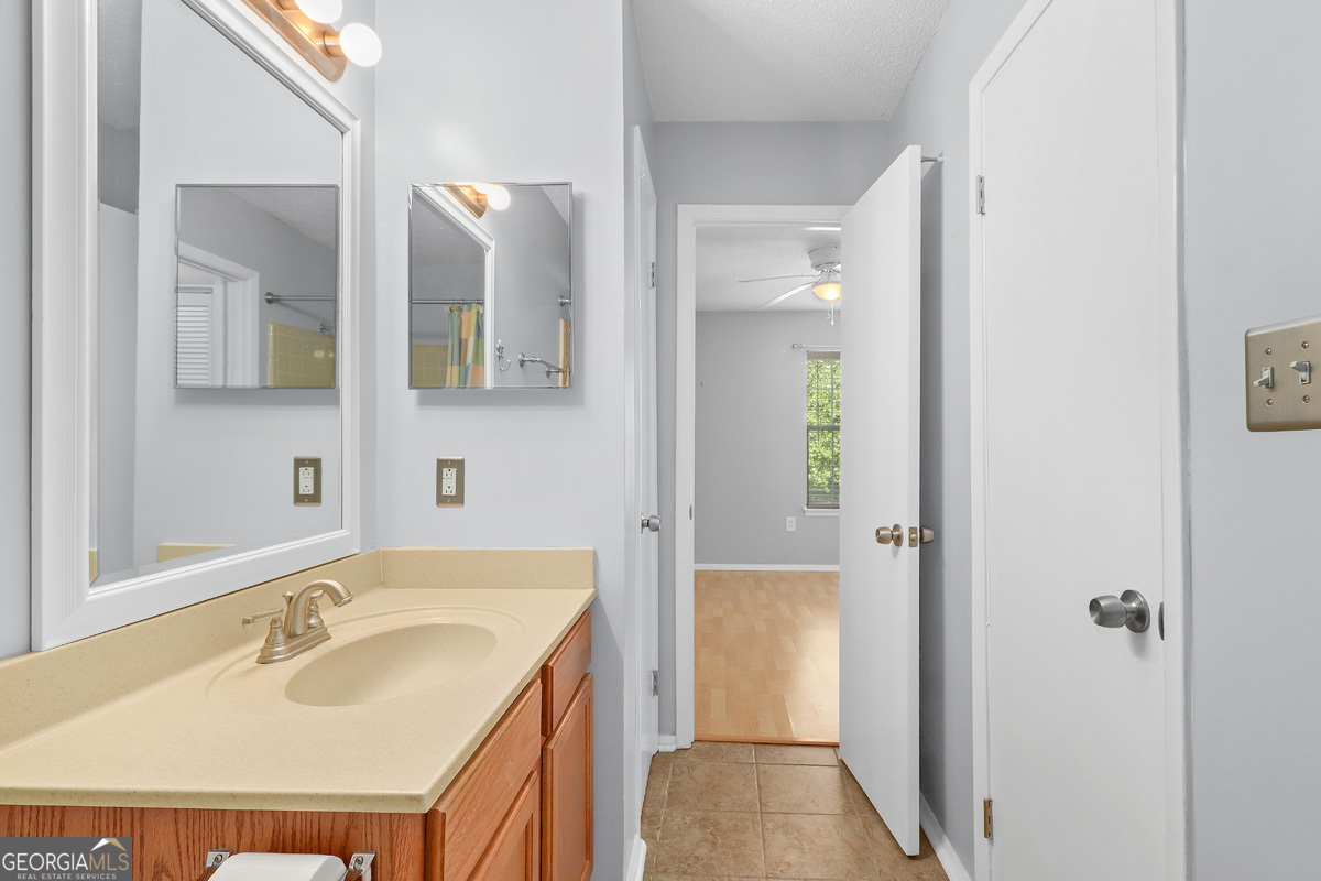 401 North Cromwell Road, Unit 2Q Savannah, GA 31410 - Photo 21 of 35 a bathroom with a sink and a mirror